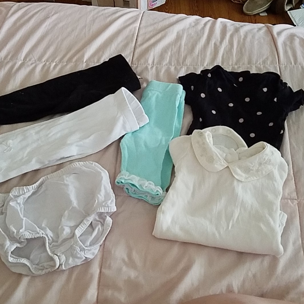 Assorted pieces of baby girl clothes